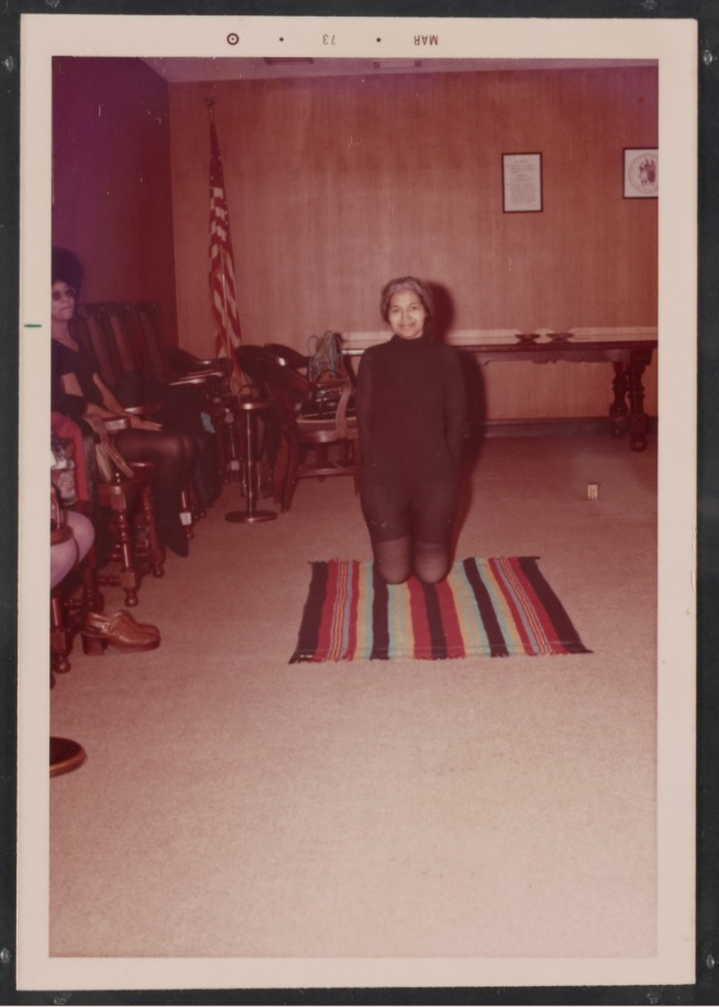 “Rosa Parks practicing yoga at an event.” 1973 March. Image courtesy of Library of Congress, Library of Congress, Prints & Photographs Division, Visual Materials from the Rosa Parks Papers, [LC-DIG-ppmsca-58369]. Photo used with permission of the Rosa and Raymond Parks Institute for Self Development.